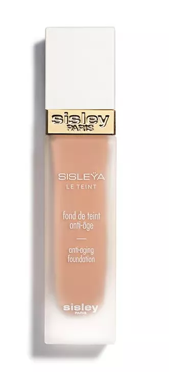 Flakon der Sisley Sisleÿa Le Teint Foundation in mattiertem Glas mit weißer Kappe und goldener Sisley-Prägung, Anti-Aging-Make-up.